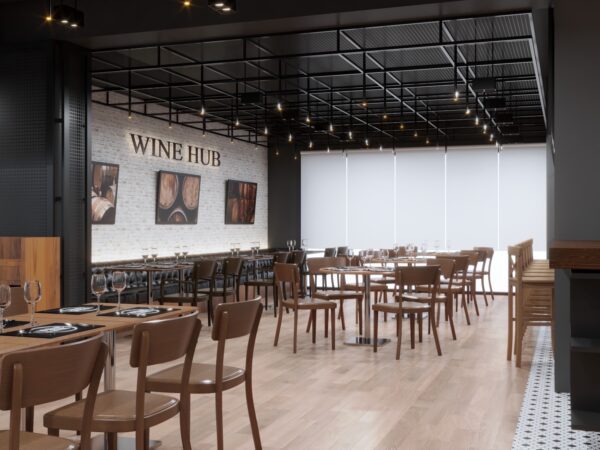 A spacious wine hub restaurant featuring wooden tables and chairs, showcasing a warm and inviting atmosphere.