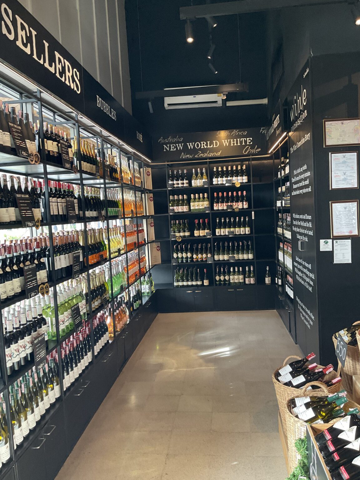 A renovated wine cellar featuring shelves stocked with a diverse selection of wine bottles, showcasing a refined ambiance.