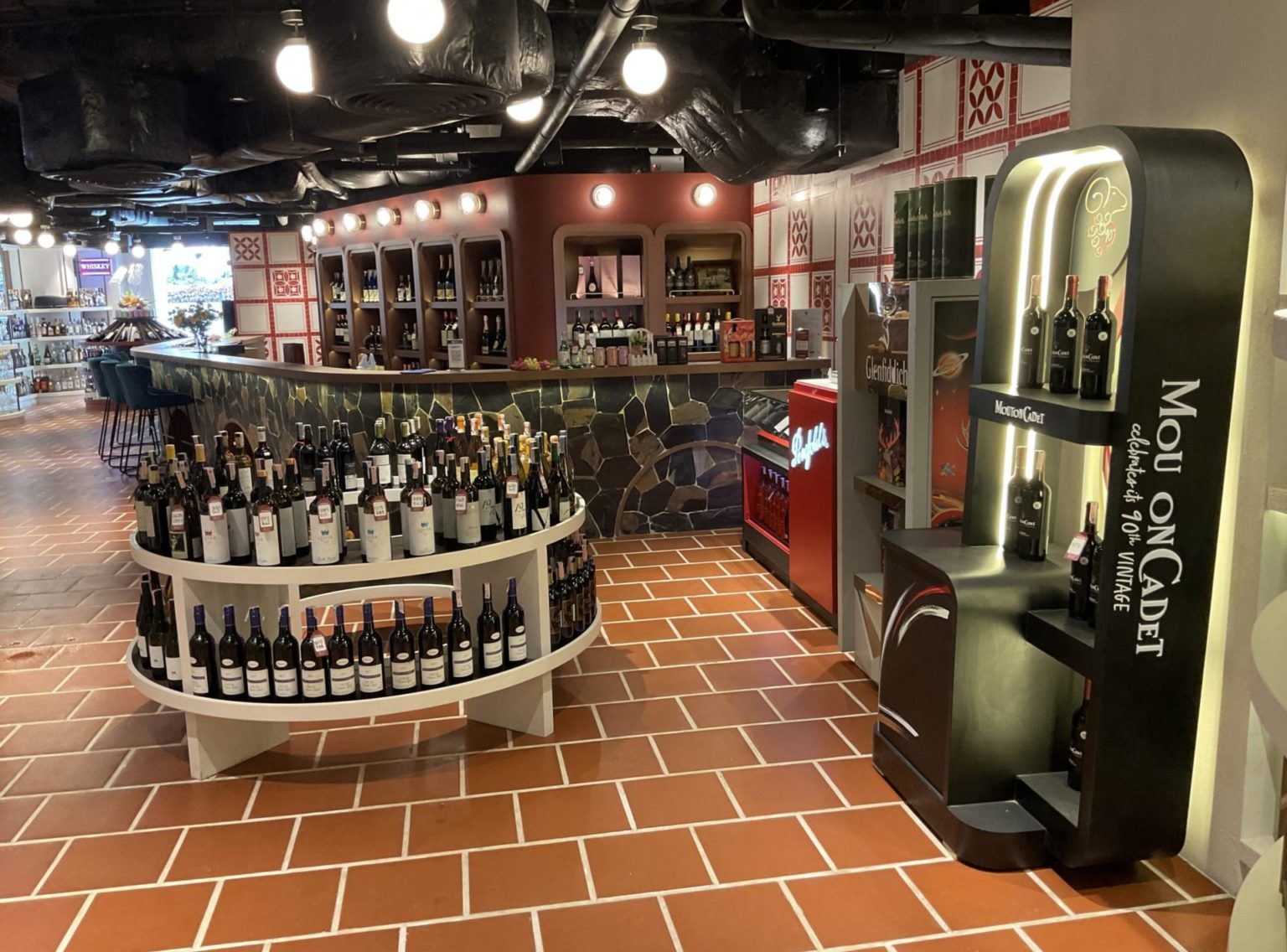 A renovated Italian restaurant bar showcasing an extensive display of wine bottles, inviting patrons to explore the selection.