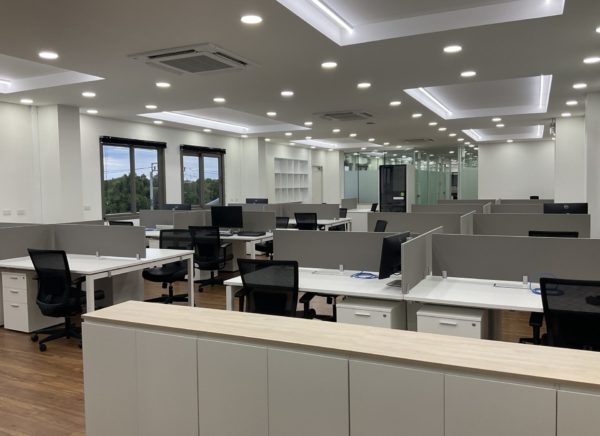 A renovated office layout with various desks and chairs, promoting a dynamic and organized workspace.