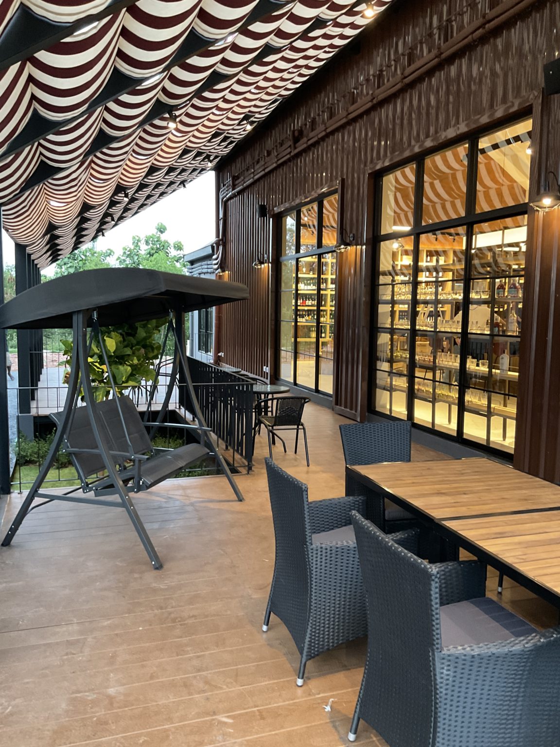 A chic restaurant space with a table and chairs, set within a beautifully renovated Italian wine showroom.