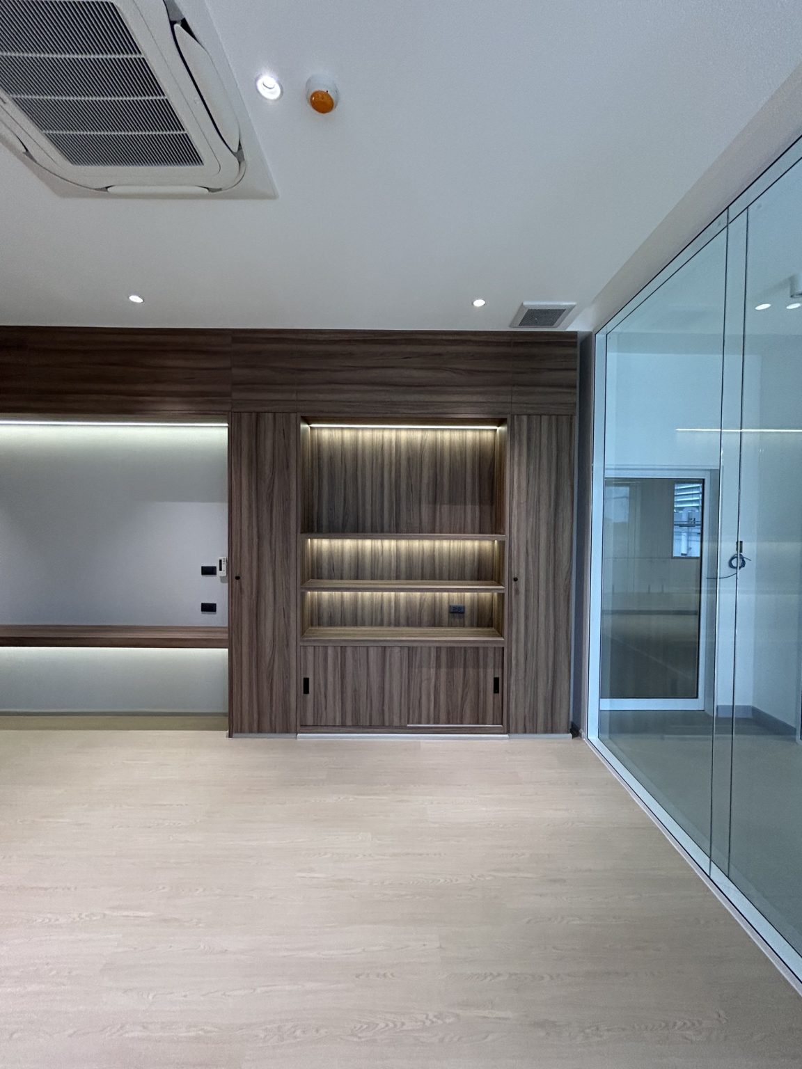 contemporary office with excellent carpentry and glass walls.