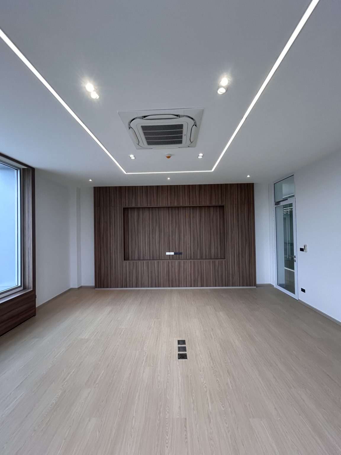 A large wooden wall in a modern office.