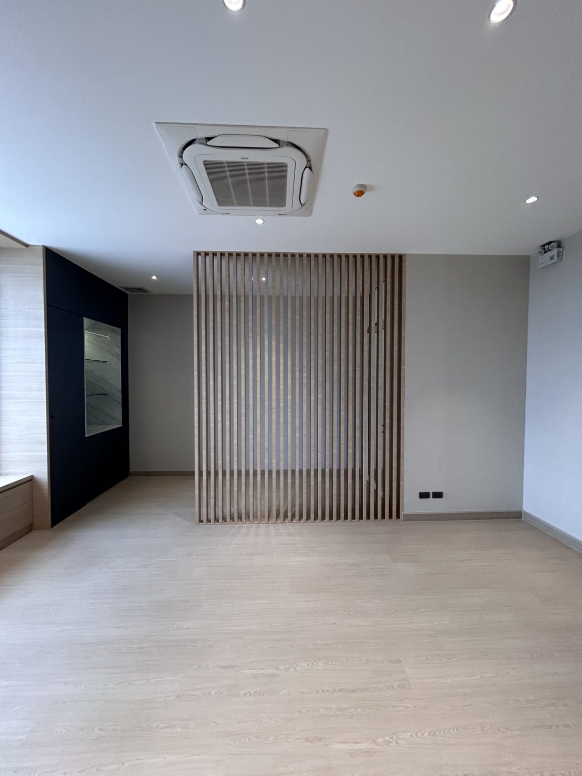 Office with modern wooden wall and floor.