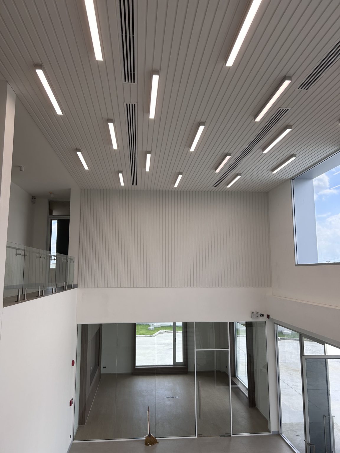 White wooden ceiling with large integrated lights.