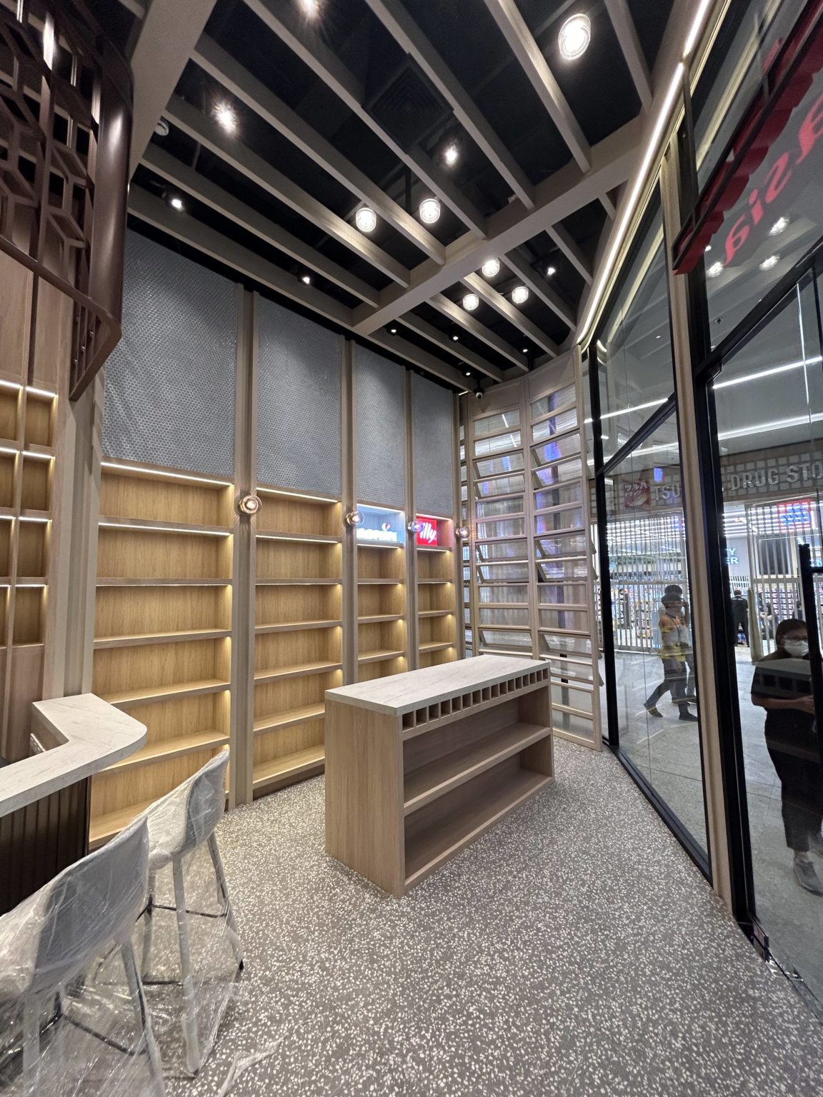 Interior Italasia, wine showroom featured with bright wooden shelves.