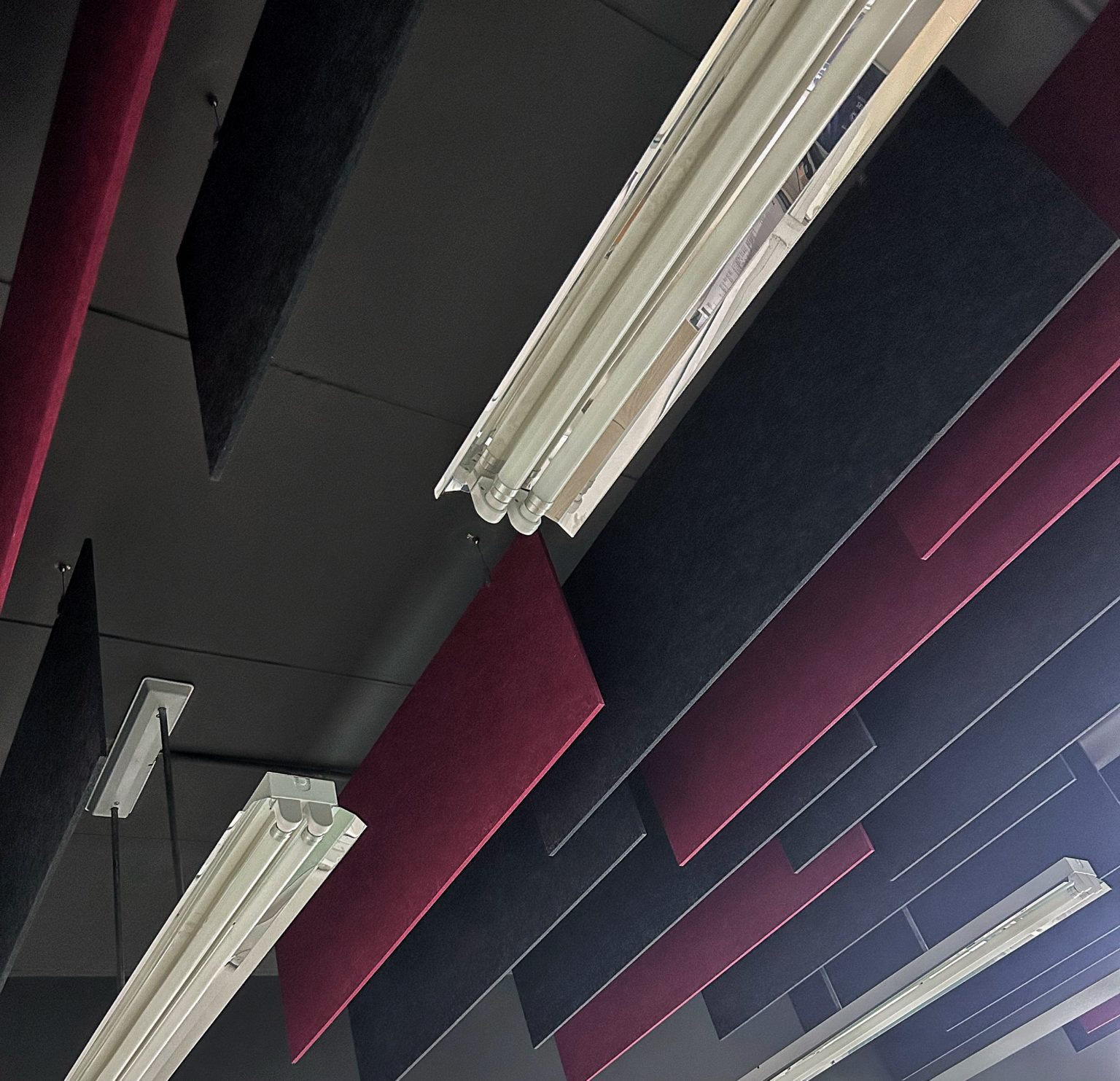 Red & black suspended acoustic panels by Project'Sabai.